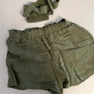Green canvas shorts with belt tie